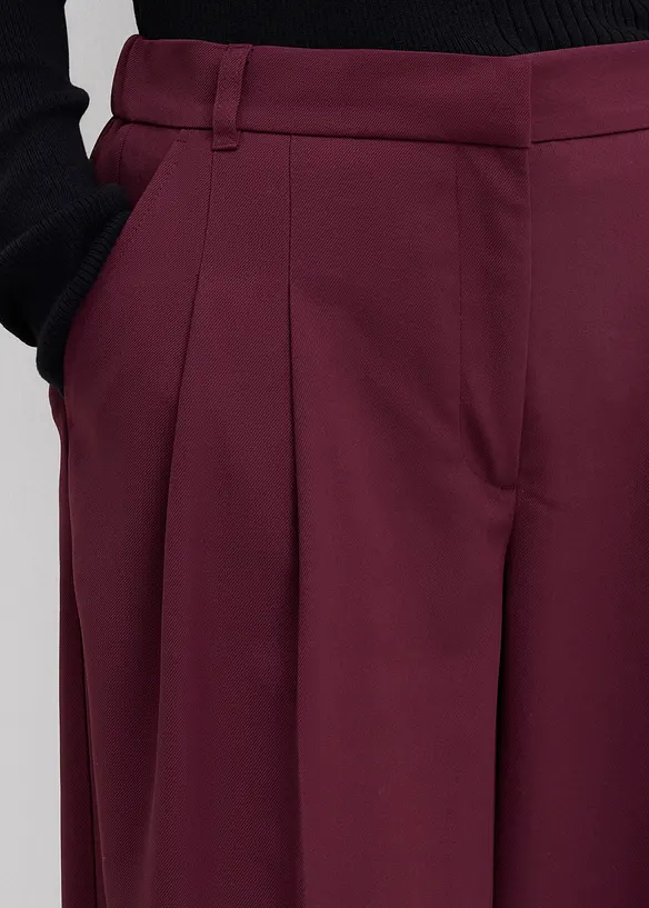 Kalhoty se sklady v pase, s pohodlným pasem a rozparky, bonprix