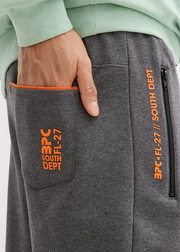 Joggingové kalhoty s praktickými kapsami na zip, z organické bavlny, bonprix