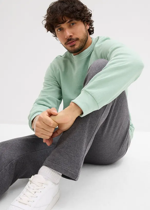 Joggingové kalhoty s praktickými kapsami na zip, z organické bavlny, bonprix