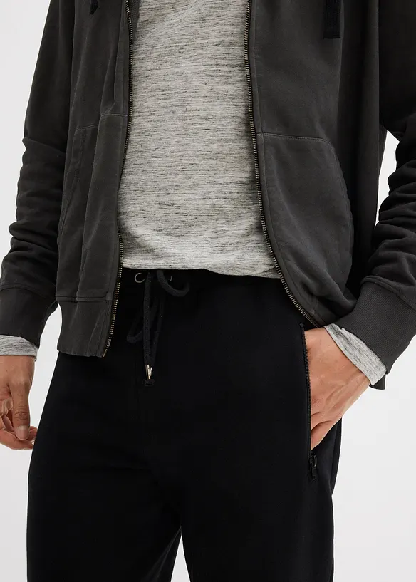 Joggingové kalhoty s praktickými kapsami na zip, z organické bavlny, bonprix